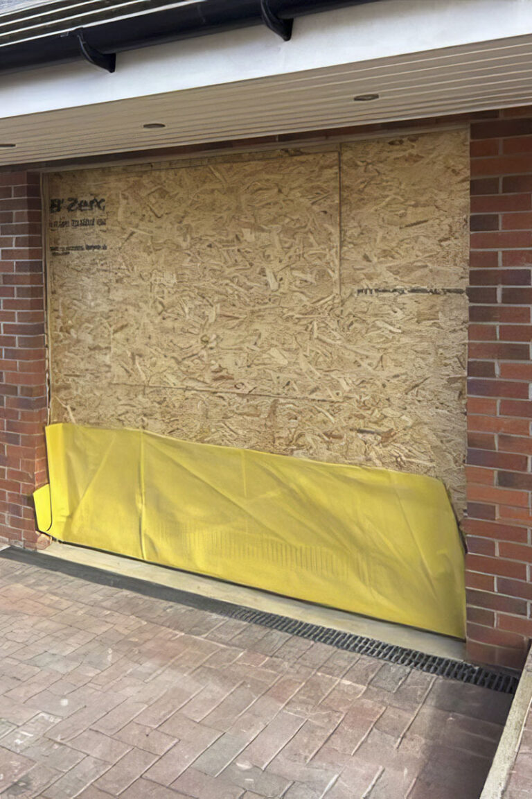 Window gap boarded up until window is fitted in a garage conversion